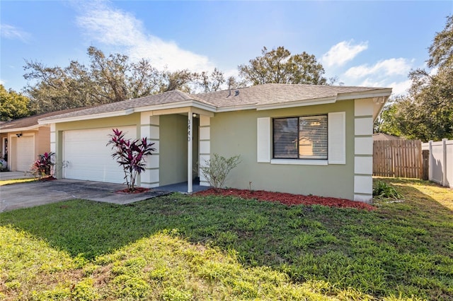 single story home with a garage and a front lawn