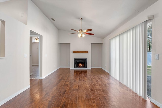 unfurnished living room with ceiling fan, dark hardwood / wood-style flooring, and lofted ceiling