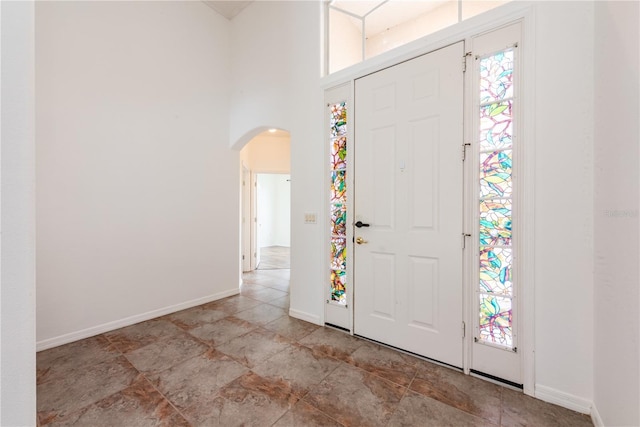 foyer entrance featuring a high ceiling