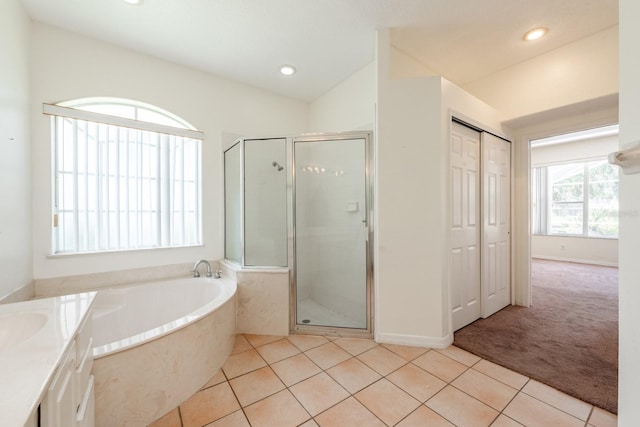 bathroom with vanity, tile patterned flooring, plus walk in shower, and vaulted ceiling