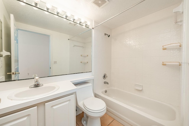 full bathroom featuring vanity, shower / tub combination, tile patterned flooring, toilet, and a textured ceiling