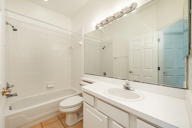 full bathroom with toilet, vanity, tiled shower / bath combo, and tile patterned floors