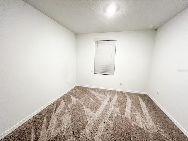 empty room with carpet flooring