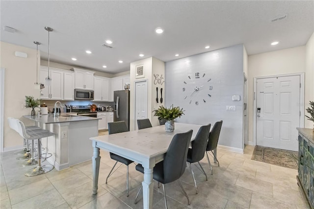 dining space featuring sink