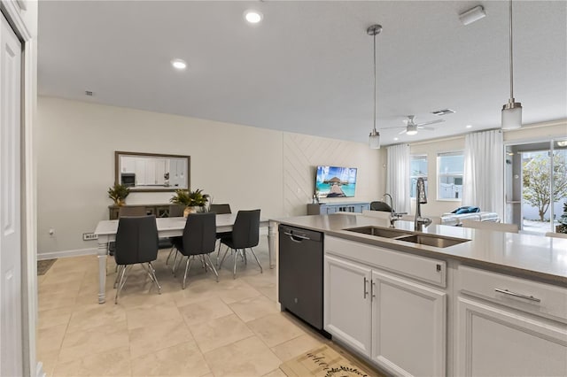 kitchen with dishwasher, white cabinets, sink, hanging light fixtures, and ceiling fan