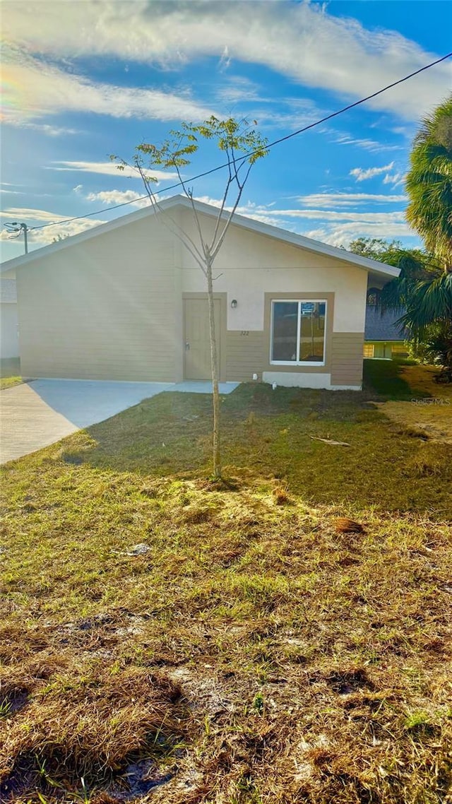 rear view of house with a yard