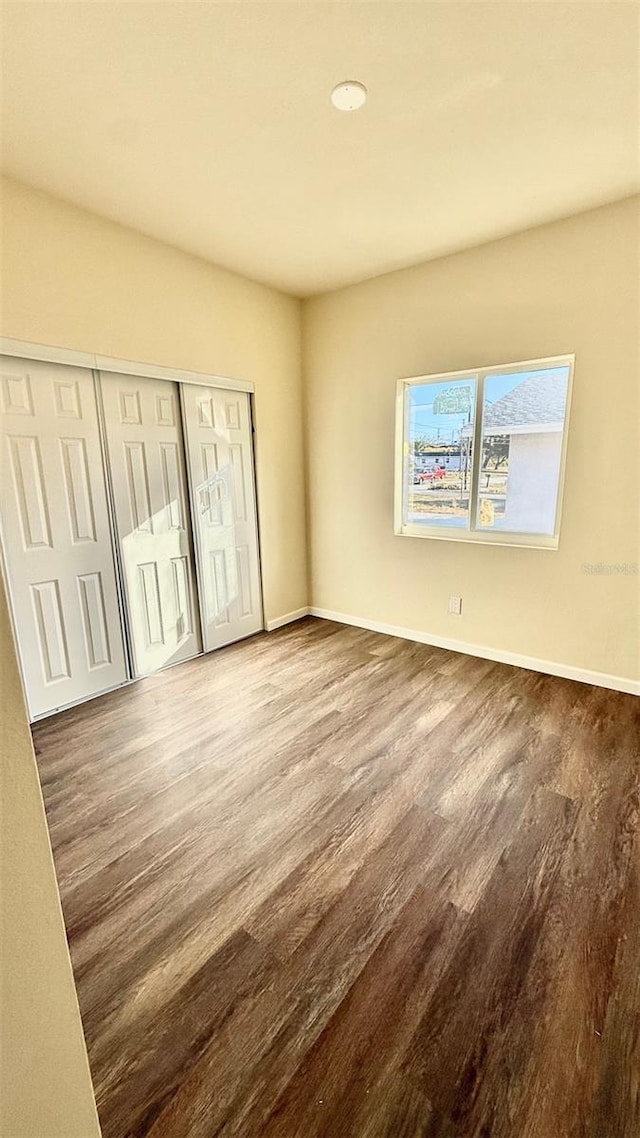 322 N 6th St, Haines City, FL 33844 - unfurnished bedroom with wood finished floors and a closet
