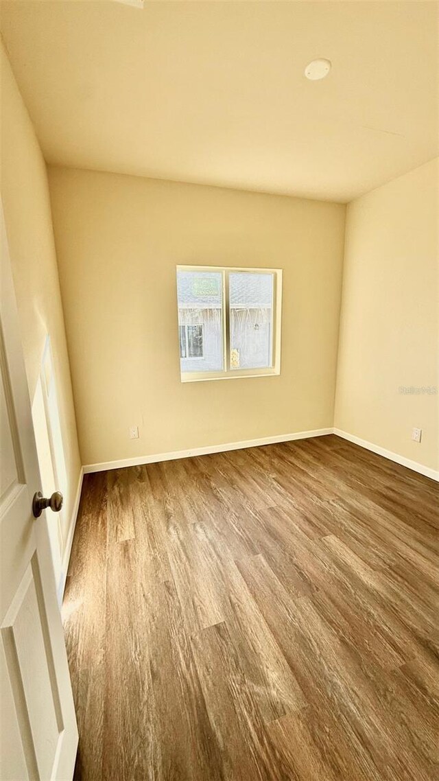 322 N 6th St, Haines City, FL 33844 - unfurnished room featuring wood finished floors and baseboards