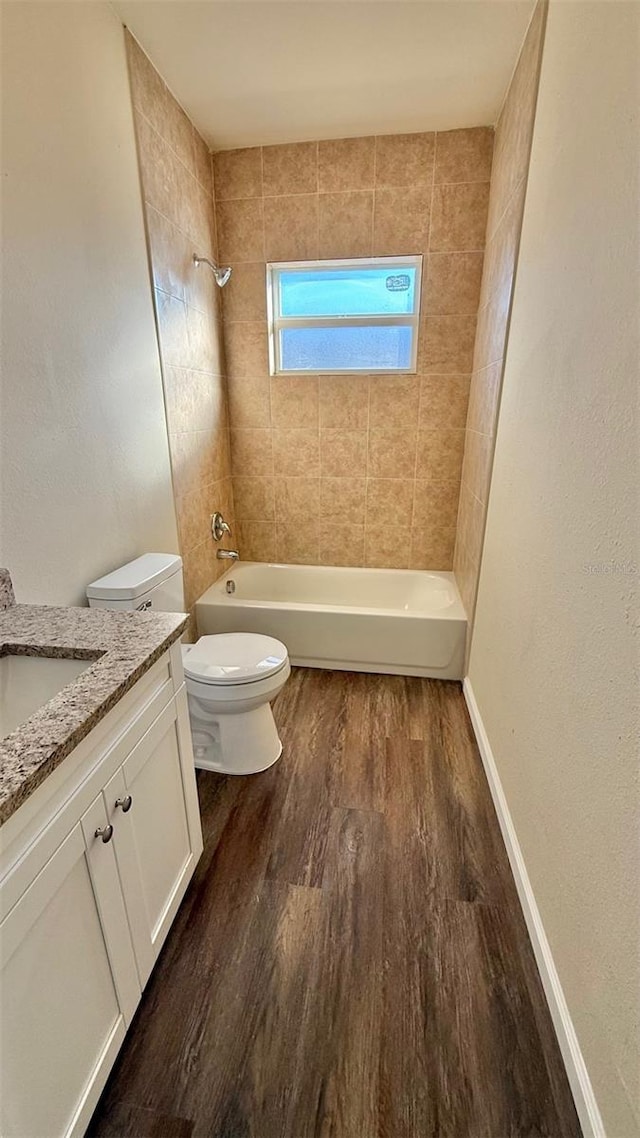 322 N 6th St, Haines City, FL 33844 - full bathroom featuring vanity, wood finished floors, and shower / bath combination