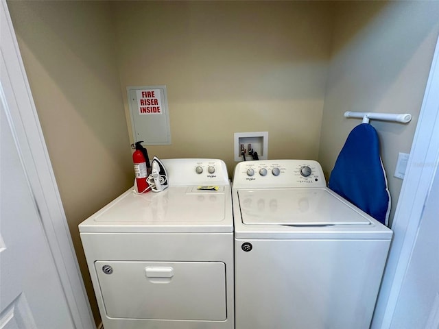 washroom featuring independent washer and dryer