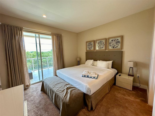 bedroom featuring access to exterior and light colored carpet