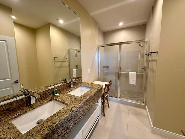 bathroom featuring vanity, tile patterned floors, and a shower with shower door