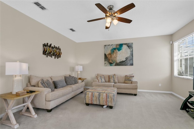 carpeted living room featuring ceiling fan