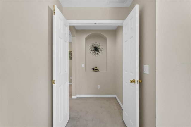 corridor with light colored carpet