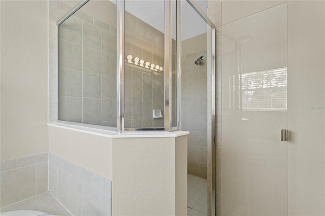 bathroom featuring an enclosed shower