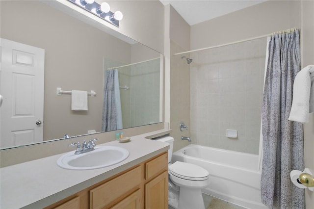 full bathroom with vanity, shower / bath combo, and toilet