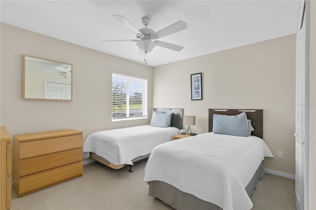 bedroom with light colored carpet and ceiling fan