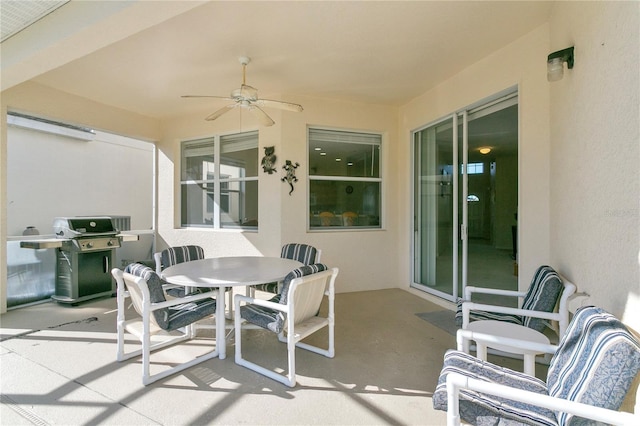 128 Higher Combe Dr, Davenport, FL 33897 - view of patio / terrace with a grill, outdoor dining space, and a ceiling fan