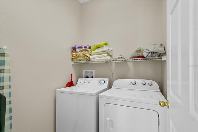 laundry room with independent washer and dryer