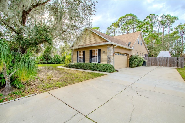 view of front of home with a garage and a front yard