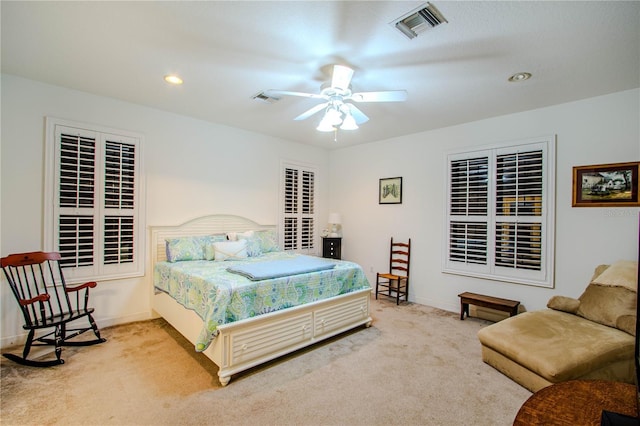 bedroom with ceiling fan and carpet