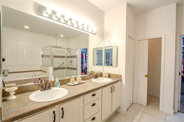 bathroom featuring tile patterned floors, vanity, and separate shower and tub