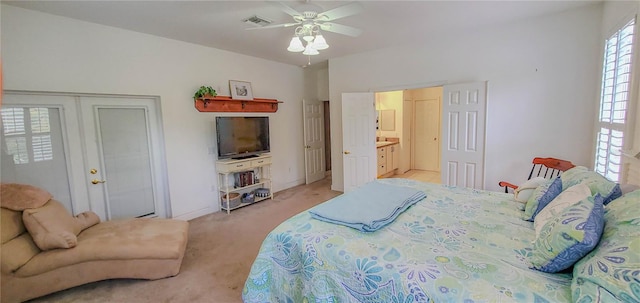 bedroom featuring light colored carpet and a ceiling fan