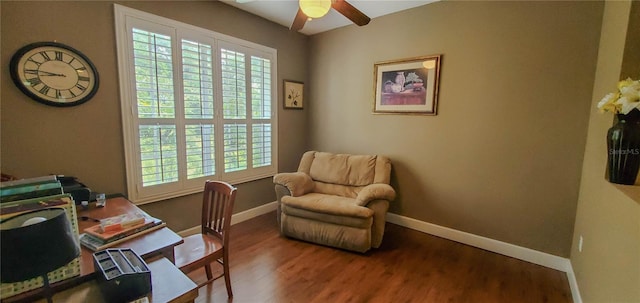 office space with a ceiling fan, wood finished floors, plenty of natural light, and baseboards