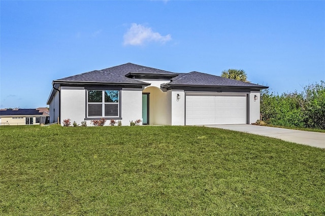 view of front facade with a front yard and a garage