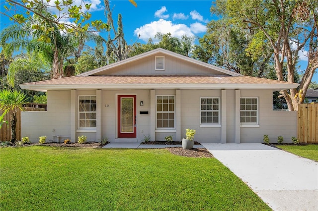 single story home with a front yard and a porch