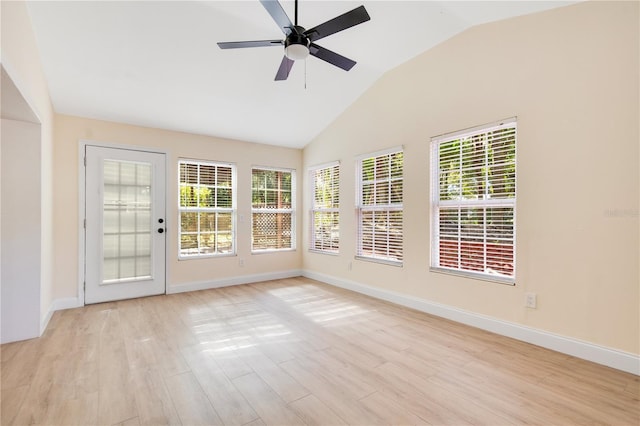 unfurnished sunroom featuring vaulted ceiling and ceiling fan