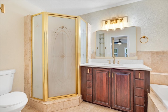 full bathroom featuring tile patterned floors, vanity, separate shower and tub, ceiling fan, and toilet