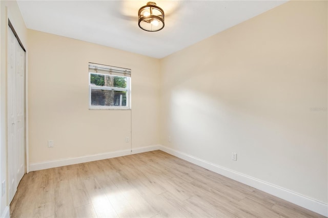 spare room featuring light wood-type flooring