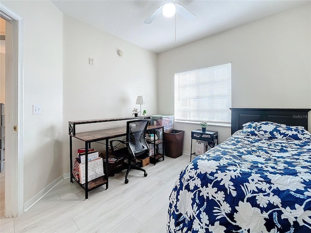 bedroom with hardwood / wood-style floors and ceiling fan