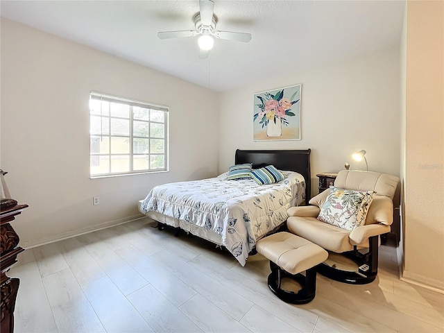 bedroom with ceiling fan and light hardwood / wood-style flooring