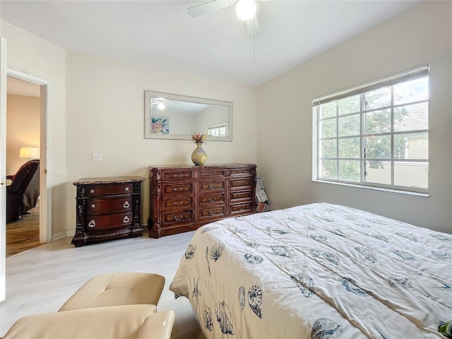 bedroom with multiple windows and ceiling fan