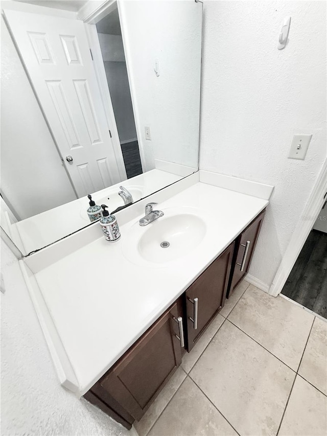 bathroom featuring vanity and tile patterned flooring