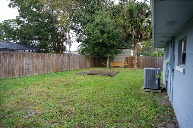 view of yard with central AC