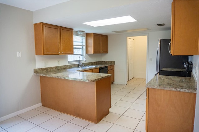 kitchen with kitchen peninsula, refrigerator, dishwasher, and sink