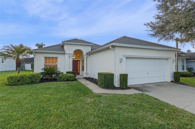 single story home featuring a garage and a front lawn