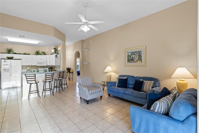 tiled living room featuring ceiling fan