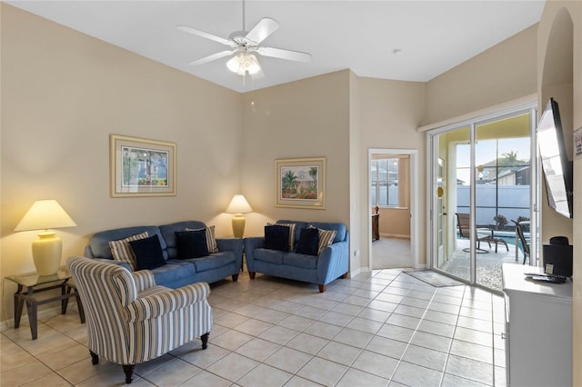 living room with light tile patterned floors and ceiling fan