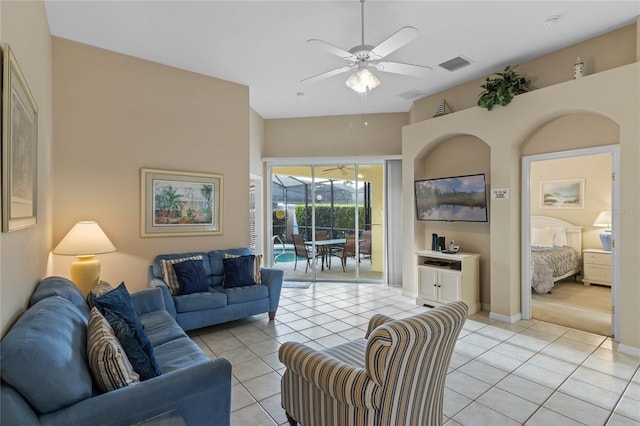 tiled living room with ceiling fan