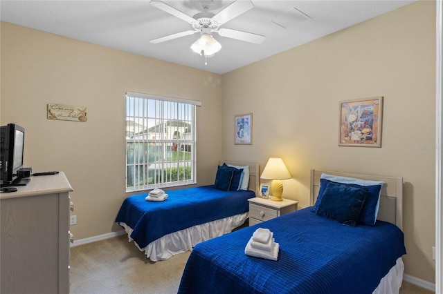 bedroom featuring ceiling fan and light colored carpet