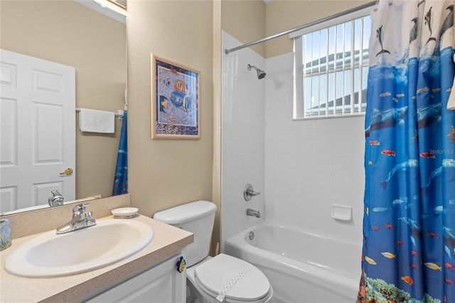 full bathroom with vanity, shower / bath combination with curtain, and toilet