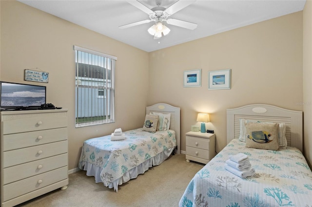 bedroom with ceiling fan and light colored carpet