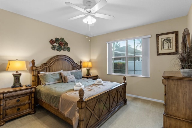 bedroom featuring ceiling fan and light carpet