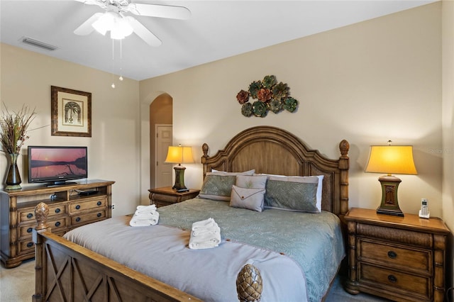 bedroom featuring light carpet and ceiling fan