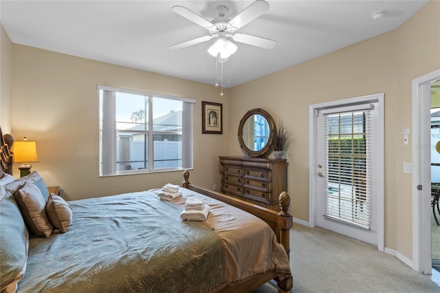 bedroom with light carpet, access to outside, and ceiling fan