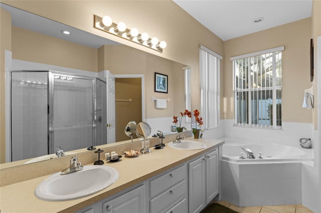 bathroom featuring tile patterned floors, vanity, and independent shower and bath